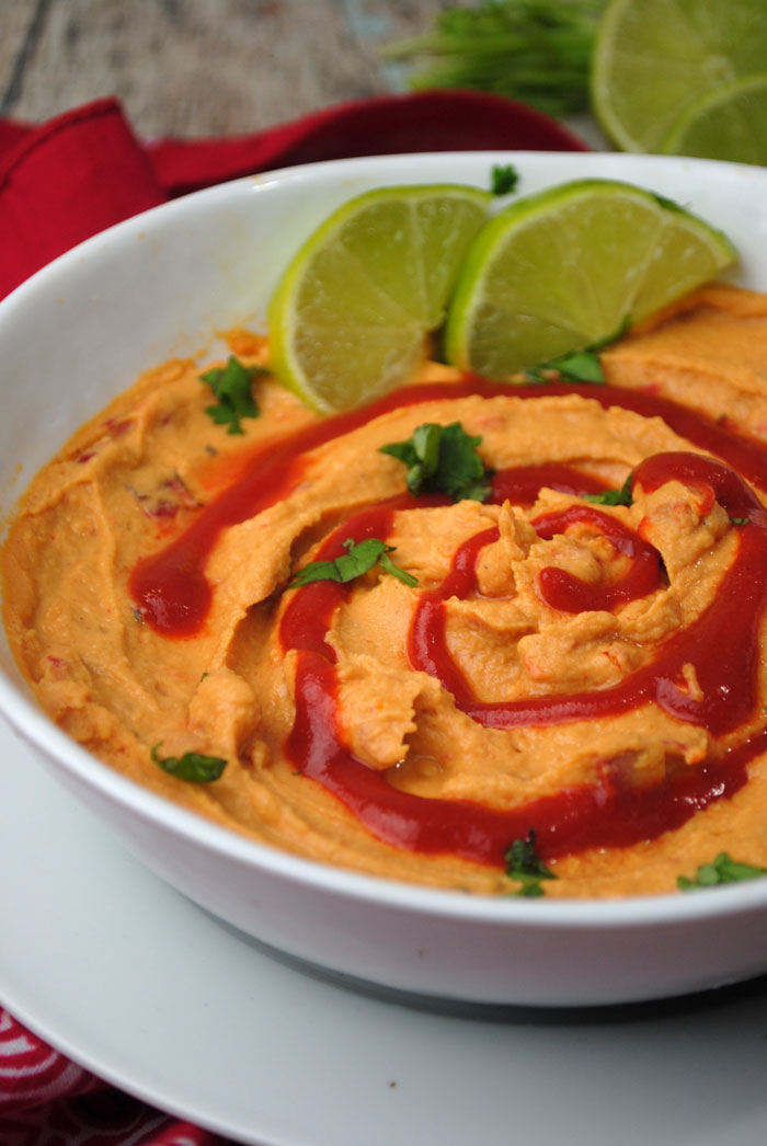 Make this delicious sriracha lime hummus recipe - a dip recipe with a kick! It's totally kid friendly and beautiful to display.