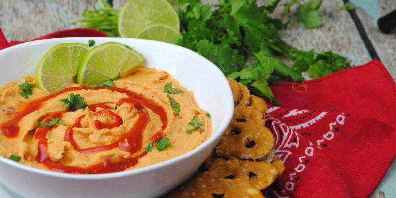 Make this delicious sriracha lime hummus recipe - a dip recipe with a kick! It's totally kid friendly and beautiful to display.