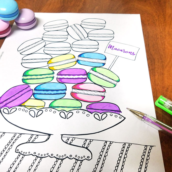 Free Printable coloring pages for adults - get this free food coloring page download for grown-ups! Color these macarons using pretty pastels or however you like them - whatever you do, just don't topple the pile! these are a great activity at a French themed event or to frame and hang as DIY kitchen decor.