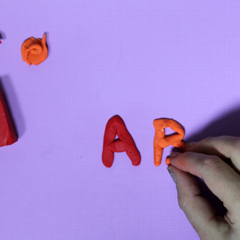 Make these fun DIY alphabet magnets using clay - love this DIY gift idea for young children! IT's a great way to teach the abc's and perfect for preschoolers. The glossy finish makes it look great.