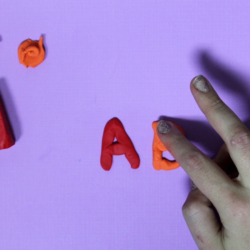 Make these fun DIY alphabet magnets using clay - love this DIY gift idea for young children! IT's a great way to teach the abc's and perfect for preschoolers. The glossy finish makes it look great.