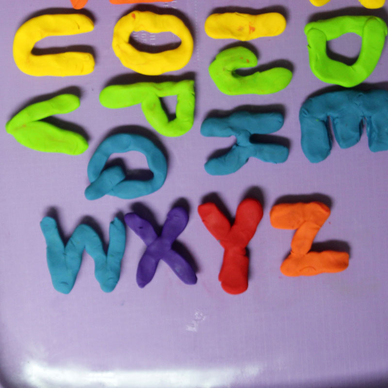 Make these fun DIY alphabet magnets using clay - love this DIY gift idea for young children! IT's a great way to teach the abc's and perfect for preschoolers. The glossy finish makes it look great.