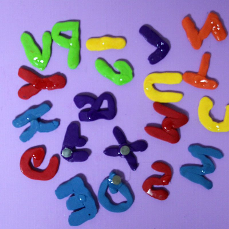 Make these fun DIY alphabet magnets using clay - love this DIY gift idea for young children! IT's a great way to teach the abc's and perfect for preschoolers. The glossy finish makes it look great.