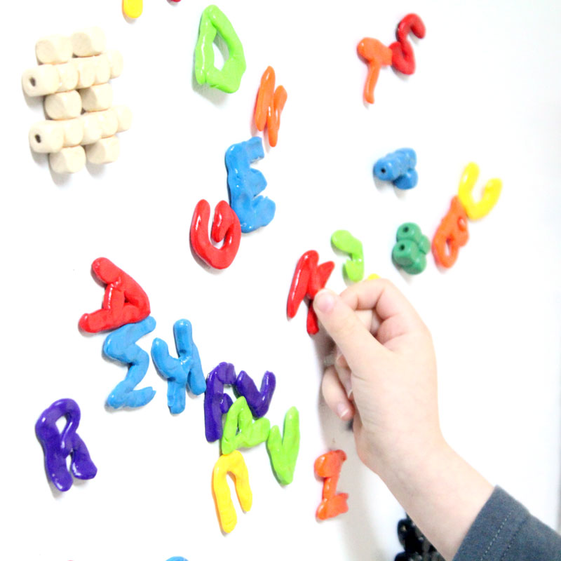 Make these fun DIY alphabet magnets using clay - love this DIY gift idea for young children! IT's a great way to teach the abc's and perfect for preschoolers. The glossy finish makes it look great.