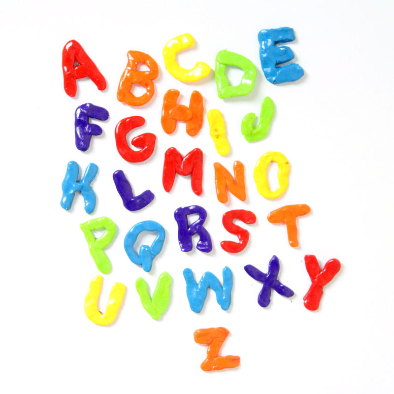 Make these fun DIY alphabet magnets using clay - love this DIY gift idea for young children! IT's a great way to teach the abc's and perfect for preschoolers. The glossy finish makes it look great.