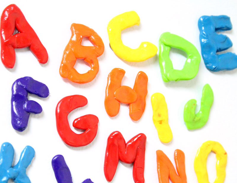 Make these fun DIY alphabet magnets using clay - love this DIY gift idea for young children! IT's a great way to teach the abc's and perfect for preschoolers. The glossy finish makes it look great.