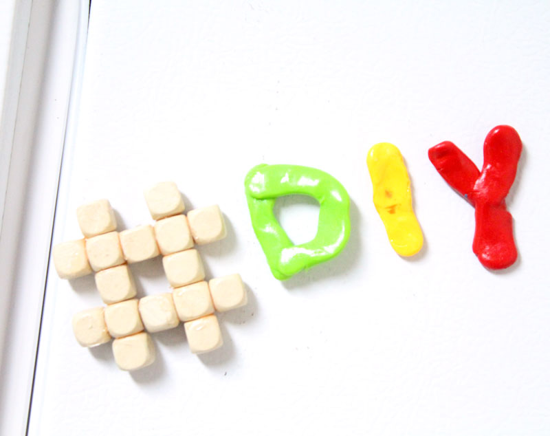 Make these fun DIY alphabet magnets using clay - love this DIY gift idea for young children! IT's a great way to teach the abc's and perfect for preschoolers. The glossy finish makes it look great.