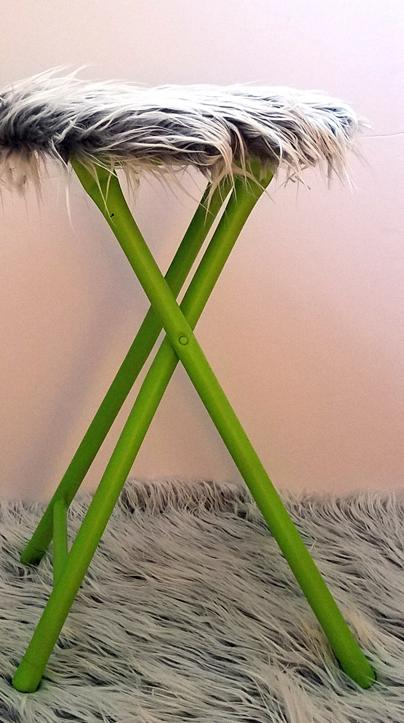 This fur stool makeover has IMPACT! It took me about half an hour including drying time... it's an easy DIY bar stool makeover that was done on a metal stool but works on wooden stools too. It's great for craft room or a teen girl's bedroom decor idea, use a round stool to sit, dress, or even as a night stand!