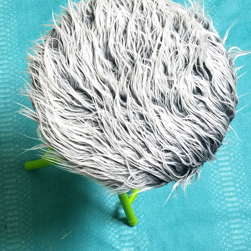 This fur stool makeover has IMPACT! It took me about half an hour including drying time... it's an easy DIY bar stool makeover that was done on a metal stool but works on wooden stools too. It's great for craft room or a teen girl's bedroom decor idea, use a round stool to sit, dress, or even as a night stand!