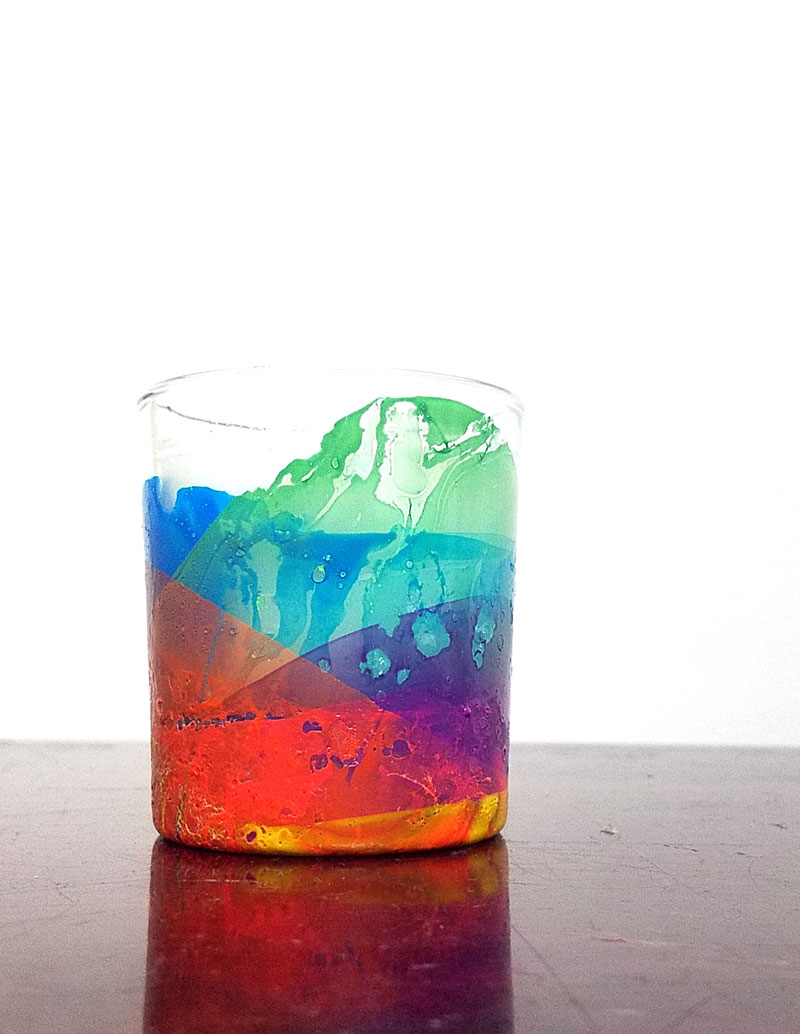 Make this beautiful rainbow candle as a DIY gift or a pretty home decor! The sheer layers of nail polish look a bit like water colors and the texture adds so much life. I had to try a few times to see the best way to make this dipped nail polish rainbow craft but now I can share my best tips with you so you'll get it right the first time (click for details)