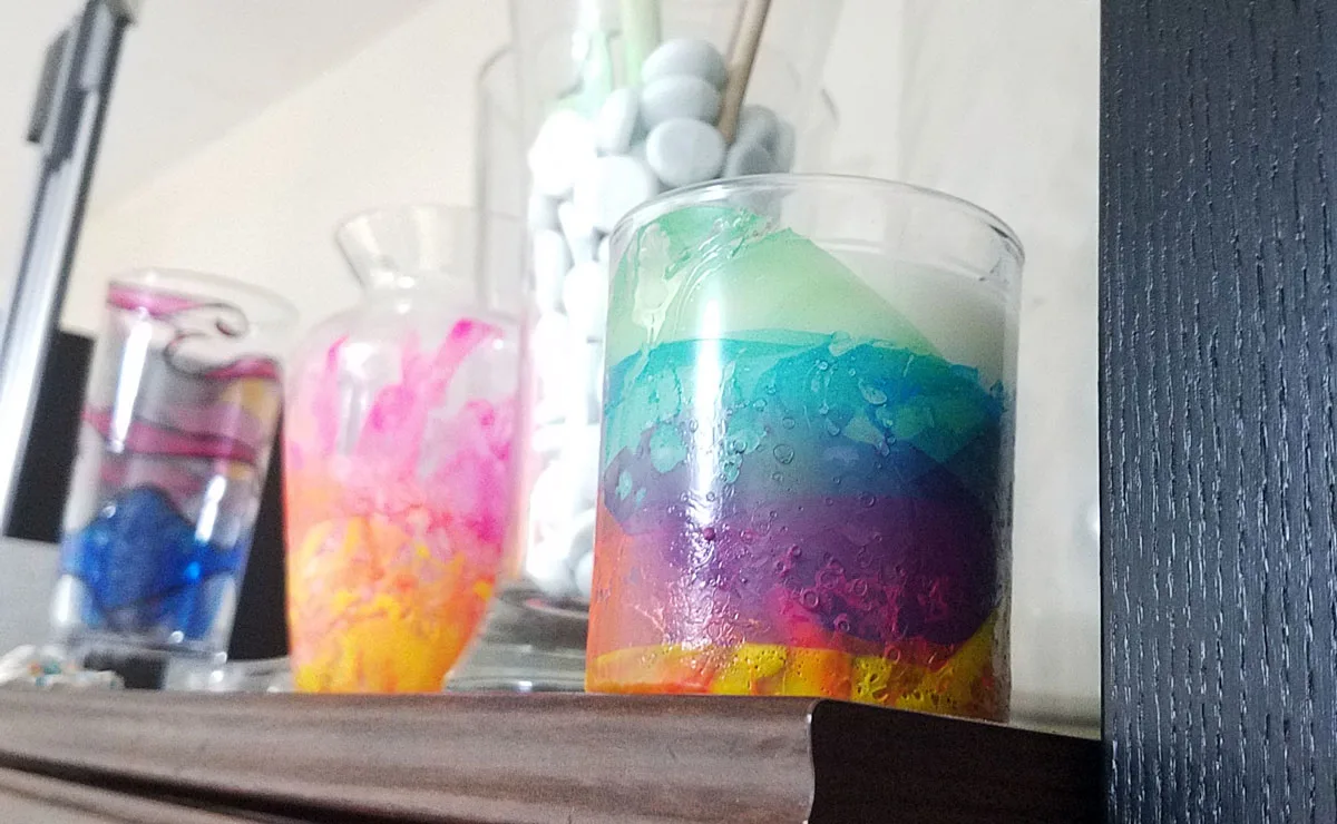 Make this beautiful rainbow candle as a DIY gift or a pretty home decor! The sheer layers of nail polish look a bit like water colors and the texture adds so much life. I had to try a few times to see the best way to make this dipped nail polish rainbow craft but now I can share my best tips with you so you'll get it right the first time (click for details)