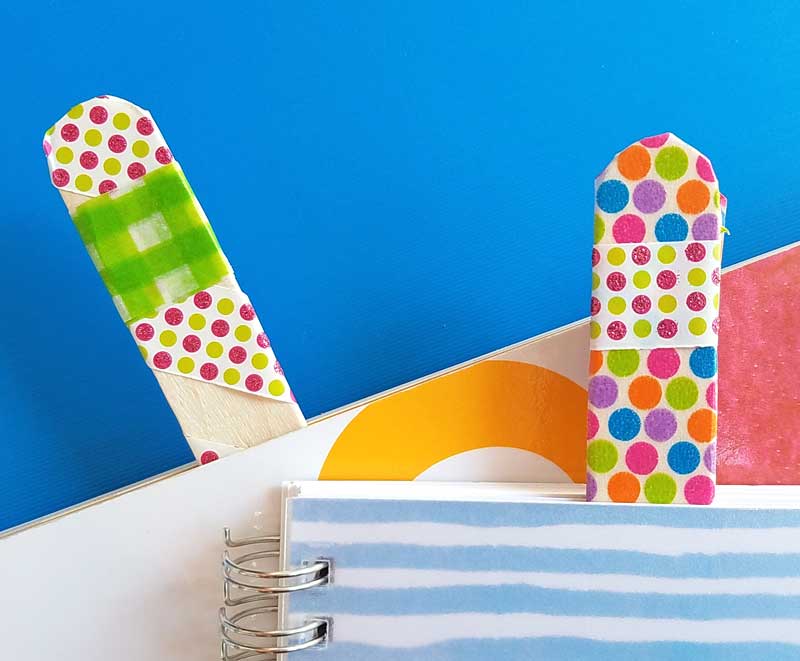 Make some fun DIY bookmarks that actually stay in place - using two fun methods! The craft stick bookmarks are a fun popsicle stick craft for kids of all ages - from toddler to teen!