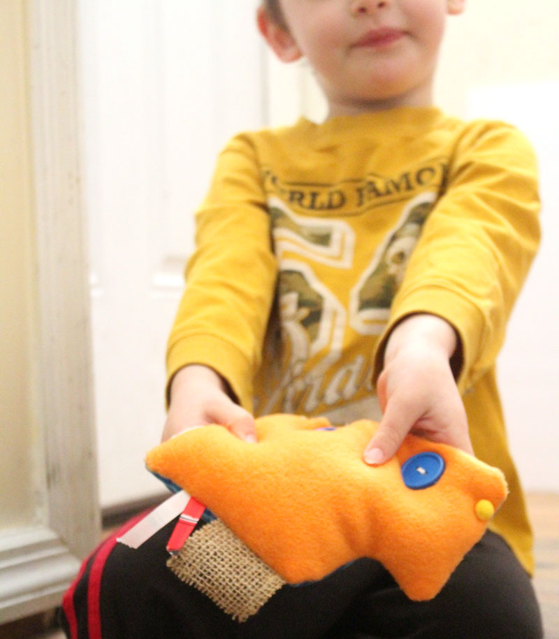 This easy DIY sensory toy is a fun beginner sewing project and DIY toy for toddlers and preschoolers. It's a weighted toy to help children with SPD, autism, or typical sensory input needs calm down, and an amazing easy calming tool for moms to create. You'll love this simple sewing craft for moms.