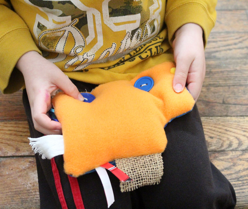 This easy DIY sensory toy is a fun beginner sewing project and DIY toy for toddlers and preschoolers. It's a weighted toy to help children with SPD, autism, or typical sensory input needs calm down, and an amazing easy calming tool for moms to create. You'll love this simple sewing craft for moms.