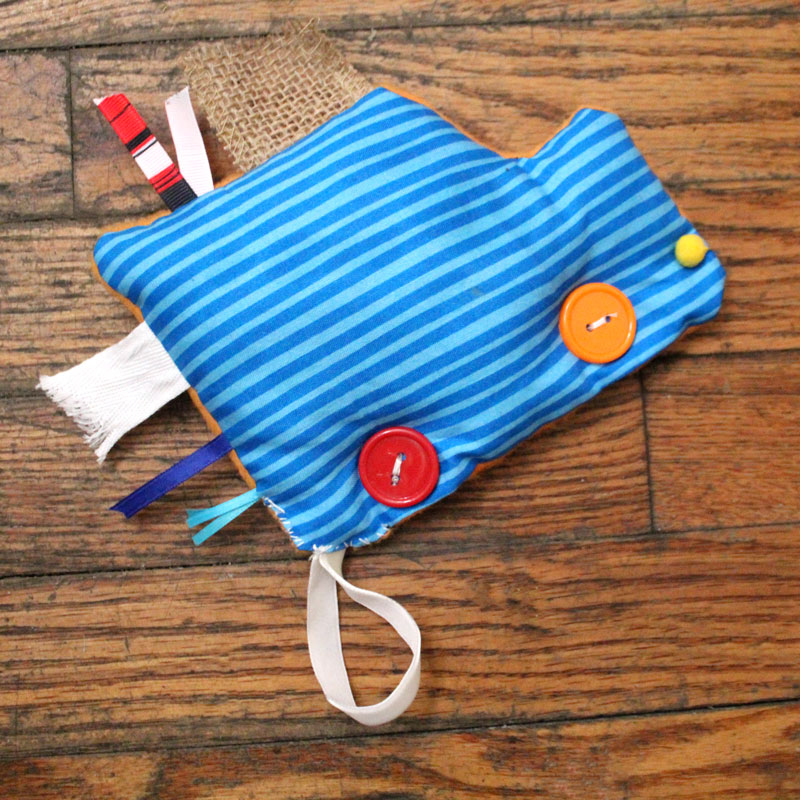 This easy DIY sensory toy is a fun beginner sewing project and DIY toy for toddlers and preschoolers. It's a weighted toy to help children with SPD, autism, or typical sensory input needs calm down, and an amazing easy calming tool for moms to create. You'll love this simple sewing craft for moms.