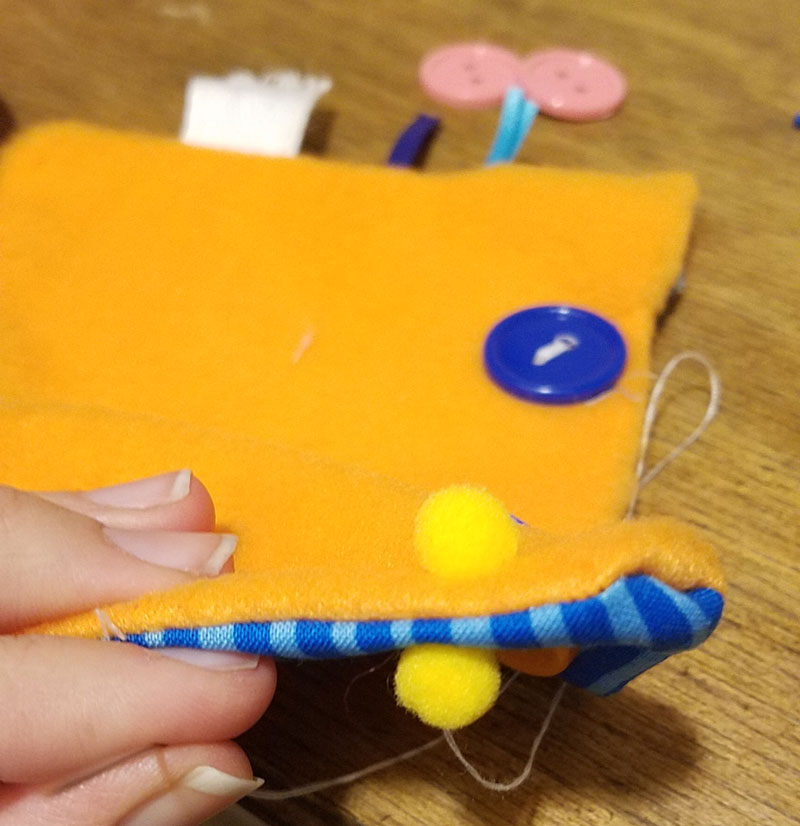 This easy DIY sensory toy is a fun beginner sewing project and DIY toy for toddlers and preschoolers. It's a weighted toy to help children with SPD, autism, or typical sensory input needs calm down, and an amazing easy calming tool for moms to create. You'll love this simple sewing craft for moms.