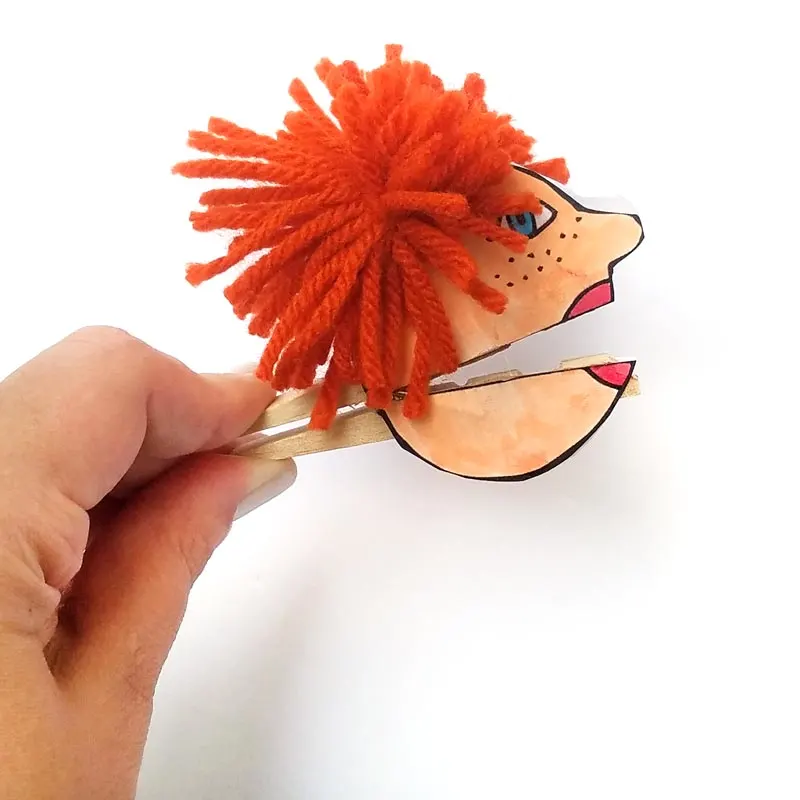 I love these adorable quirky paper puppets - with mouthes that open and close with a clothespin! Love this unique, easy clothespin craft for kids (or adults). It includes a free printable for the faces, which you can then color in, and add yarn and googly eyes for character. This free printable coloring page craft is so cool!