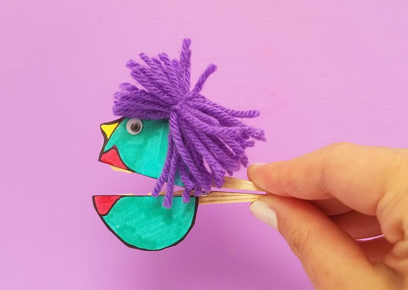 I love these adorable quirky paper puppets - with mouthes that open and close with a clothespin! Love this unique, easy clothespin craft for kids (or adults). It includes a free printable for the faces, which you can then color in, and add yarn and googly eyes for character. This free printable coloring page craft is so cool!