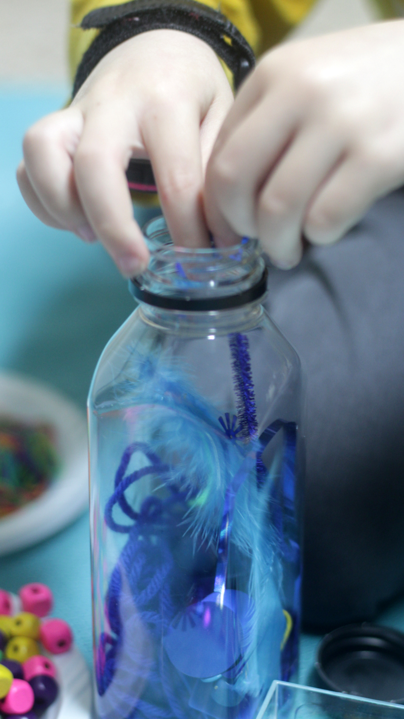 Make favorite color discovery bottles - a child-led activity that's perfect for teaching colors! This color activity for toddlers, preschoolers, and kindergarten is a great kid-made sensory bottle that will be played with for hours!