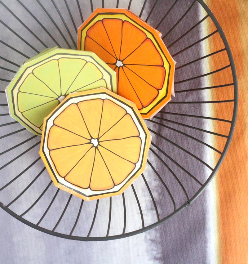 These free printable citrus fruit coloring pages fold into surprise message cards - put a photo inside, write a corny love note, either way it will be loved! This citrus paper craft works as a DIY paper toy and the fun lemon, orange, and lime slices can be played with or given as gifts.