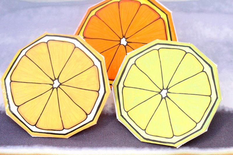 These free printable citrus fruit coloring pages fold into surprise message cards - put a photo inside, write a corny love note, either way it will be loved! This citrus paper craft works as a DIY paper toy and the fun lemon, orange, and lime slices can be played with or given as gifts. 