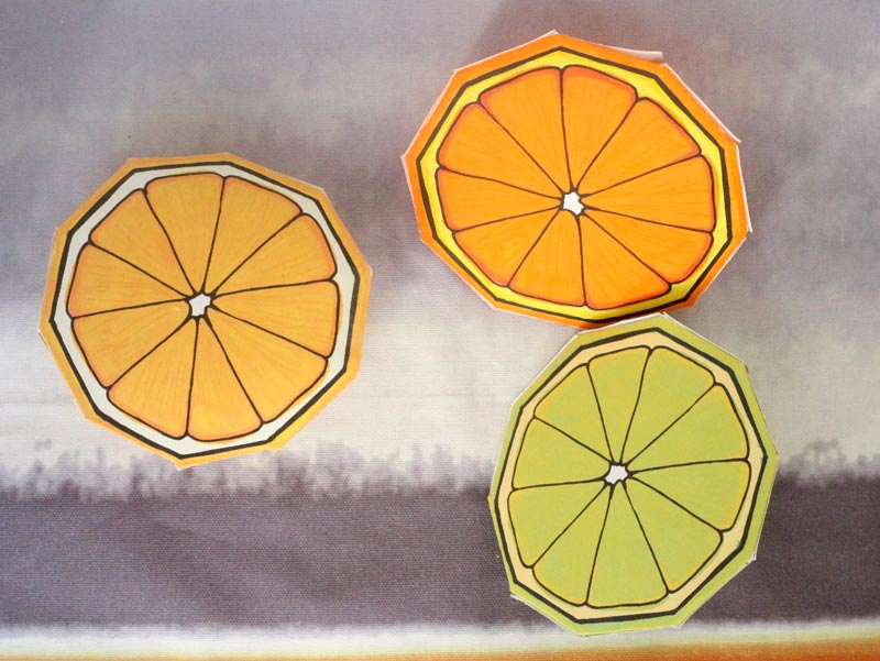 These free printable citrus fruit coloring pages fold into surprise message cards - put a photo inside, write a corny love note, either way it will be loved! This citrus paper craft works as a DIY paper toy and the fun lemon, orange, and lime slices can be played with or given as gifts. 