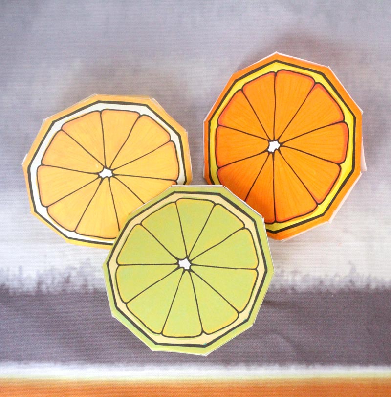 These free printable citrus fruit coloring pages fold into surprise message cards - put a photo inside, write a corny love note, either way it will be loved! This citrus paper craft works as a DIY paper toy and the fun lemon, orange, and lime slices can be played with or given as gifts. 