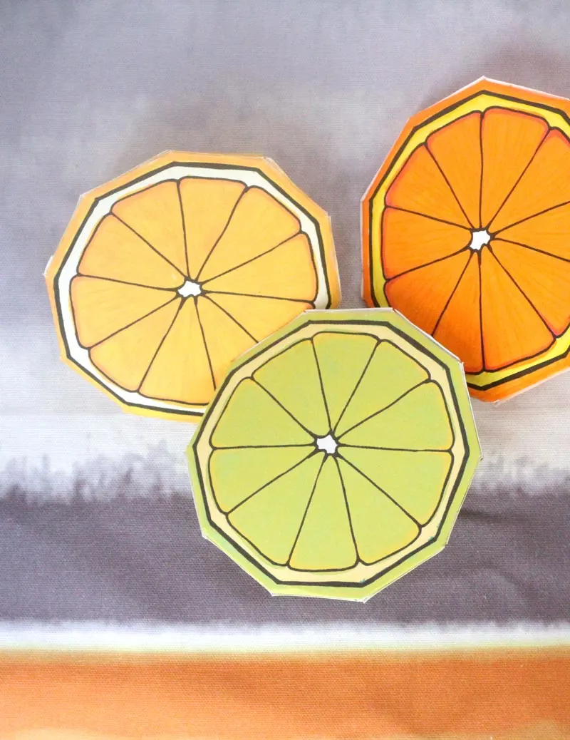 These free printable citrus fruit coloring pages fold into surprise message cards - put a photo inside, write a corny love note, either way it will be loved! This citrus paper craft works as a DIY paper toy and the fun lemon, orange, and lime slices can be played with or given as gifts. 