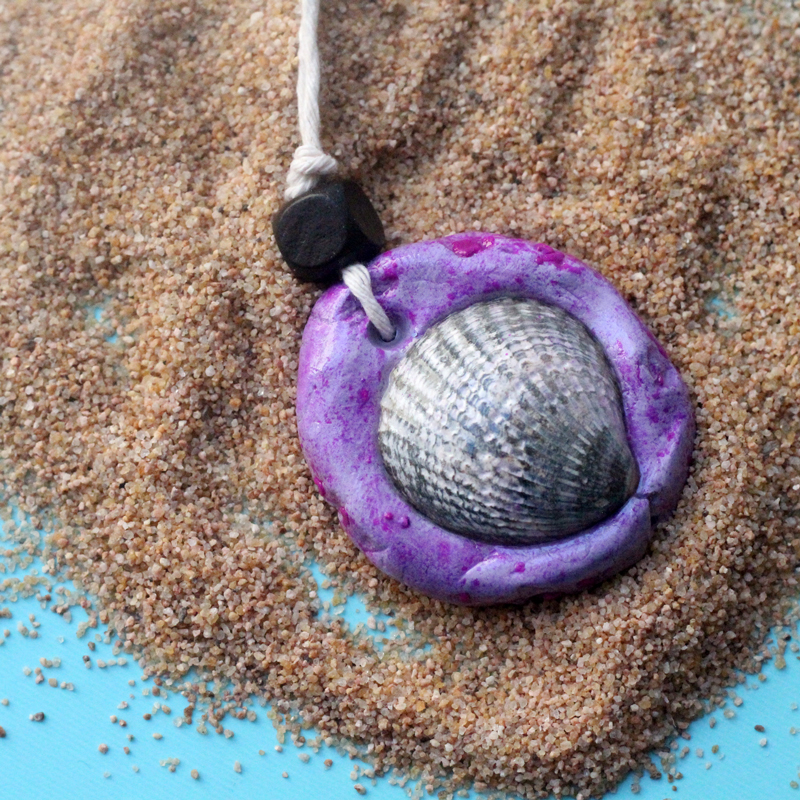 Make an easy DIY seashell necklace for your little mermaid - this easy jewelry making craft for kids is also a perfect summer camp activity for tweens and teens! It's made from air dry clay and a super cool glaze, with instructions for adding different textures to the clay.