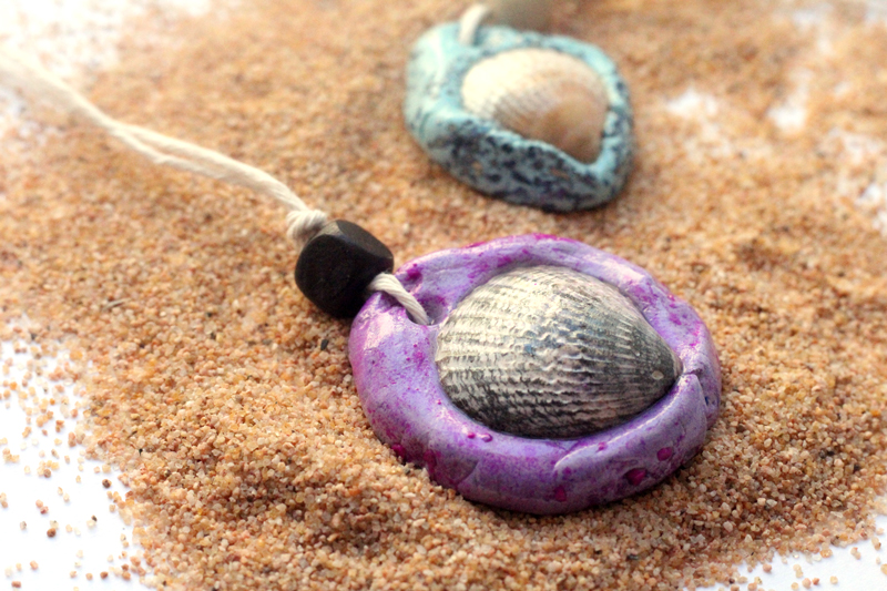 Make an easy DIY seashell necklace for your little mermaid - this easy jewelry making craft for kids is also a perfect summer camp activity for tweens and teens! It's made from air dry clay and a super cool glaze, with instructions for adding different textures to the clay.