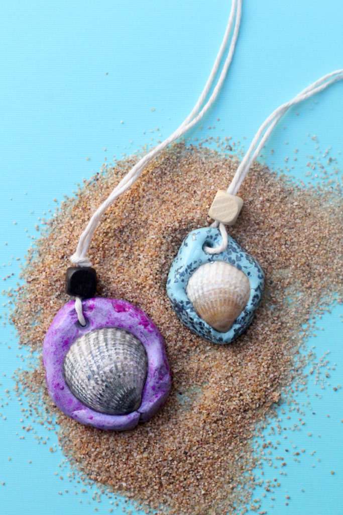 Make an easy DIY seashell necklace for your little mermaid - this easy jewelry making craft for kids is also a perfect summer camp activity for tweens and teens! It's made from air dry clay and a super cool glaze, with instructions for adding different textures to the clay.