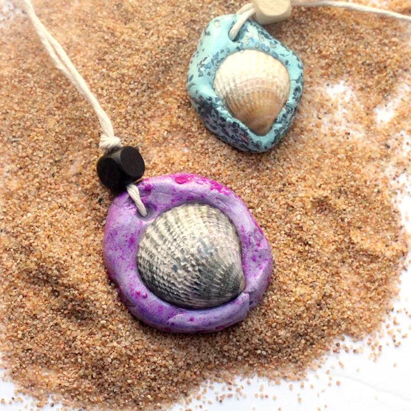 Make an easy DIY seashell necklace for your little mermaid - this easy jewelry making craft for kids is also a perfect summer camp activity for tweens and teens! It's made from air dry clay and a super cool glaze, with instructions for adding different textures to the clay.