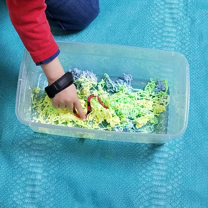 Make a slippery slimy snake sensory bin - the perfect sensory activity for preschoolers! This water play idea is so quick and easy to set up and such a sanity-saver.