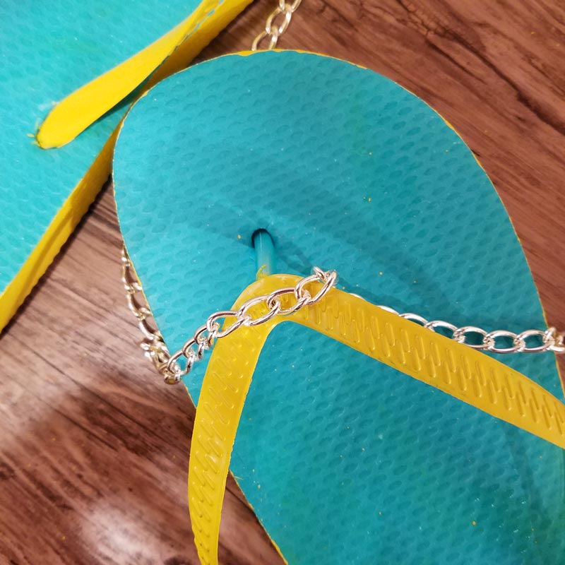 Make your cheap dollar store flip flops look super cool with these DIY flip flops - an easy summer camp craft for teens and tweens - or grown-ups too!