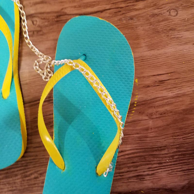 Make your cheap dollar store flip flops look super cool with these DIY flip flops - an easy summer camp craft for teens and tweens - or grown-ups too!