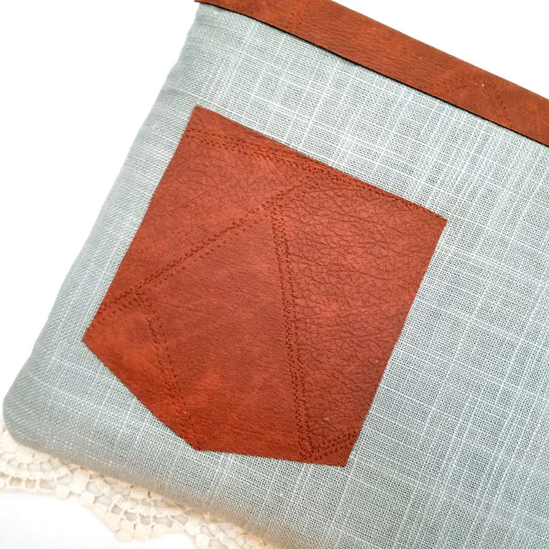 Make an easy DIY laptop sleeve - this quick and easy sewing tutorial for a laptop or tablet case has beautiful linen and leatherette detail! The leather gives it a bright touch, the lace makes it a bit feminine. You'll love it! No pattern needed - fits with any size computer notebook! I made it for a Surface Pro 4.