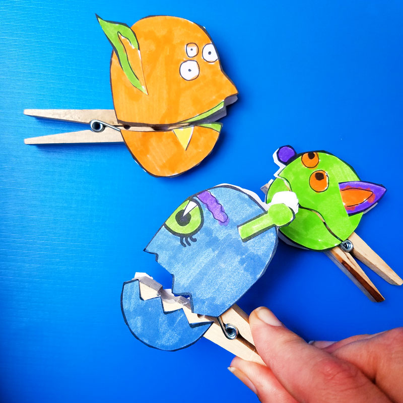 Make these adorable monster clothespin puppets using the free printable template - and then play "Feed the Monster" - a fun fine motor activity and game to help improve pincer grasp! You'll love this paper craft and free printable activity for kids. It's also great for Halloween crafts but fun for year-round too.