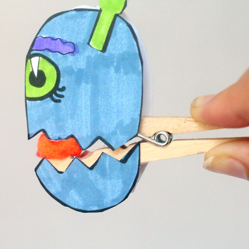 Make these adorable monster clothespin puppets using the free printable template - and then play "Feed the Monster" - a fun fine motor activity and game to help improve pincer grasp! You'll love this paper craft and free printable activity for kids. It's also great for Halloween crafts but fun for year-round too.