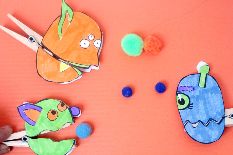 Make these adorable monster clothespin puppets using the free printable template - and then play "Feed the Monster" - a fun fine motor activity and game to help improve pincer grasp! You'll love this paper craft and free printable activity for kids. It's also great for Halloween crafts but fun for year-round too.