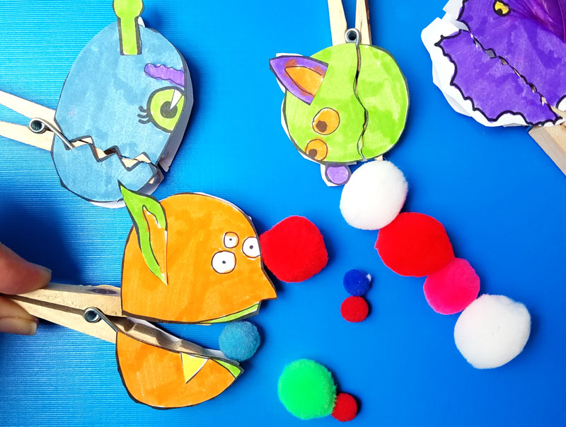 Make these adorable monster clothespin puppets using the free printable template - and then play "Feed the Monster" - a fun fine motor activity and game to help improve pincer grasp! You'll love this paper craft and free printable activity for kids. It's also great for Halloween crafts but fun for year-round too.