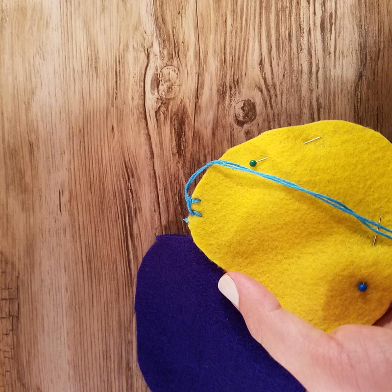 Make this DIY fidget spinner case to protect your fidget toy and keep it a bit farther out of reach of babies! It's an easy beginner felt sewing project that an adult or a child can make, plus it has a built in zipper fidget too! Free template / pattern included.