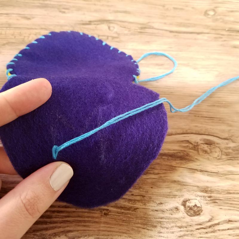 Make this DIY fidget spinner case to protect your fidget toy and keep it a bit farther out of reach of babies! It's an easy beginner felt sewing project that an adult or a child can make, plus it has a built in zipper fidget too! Free template / pattern included.