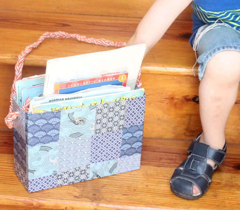 Make this DIY book tote from a recycled cereal box to transport books from the bookshelf to the reading nook! I love this idea because we have a few reading corners in our home, and it's a great way to keep things organized and neat.