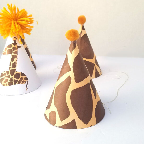 You'll love this giraffe birthday hat - including a free printable version! It's perfect for your giraffe birthday theme, or a jugle themed birthday party, or even a safari theme! It also includes a fun idea for a first birthday party theme for boys.
