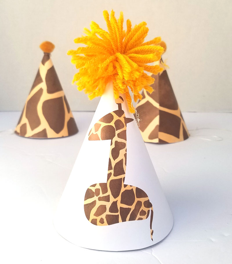 You'll love this giraffe birthday hat - including a free printable version! It's perfect for your giraffe birthday theme, or a jugle themed birthday party, or even a safari theme! It also includes a fun idea for a first birthday party theme for boys.