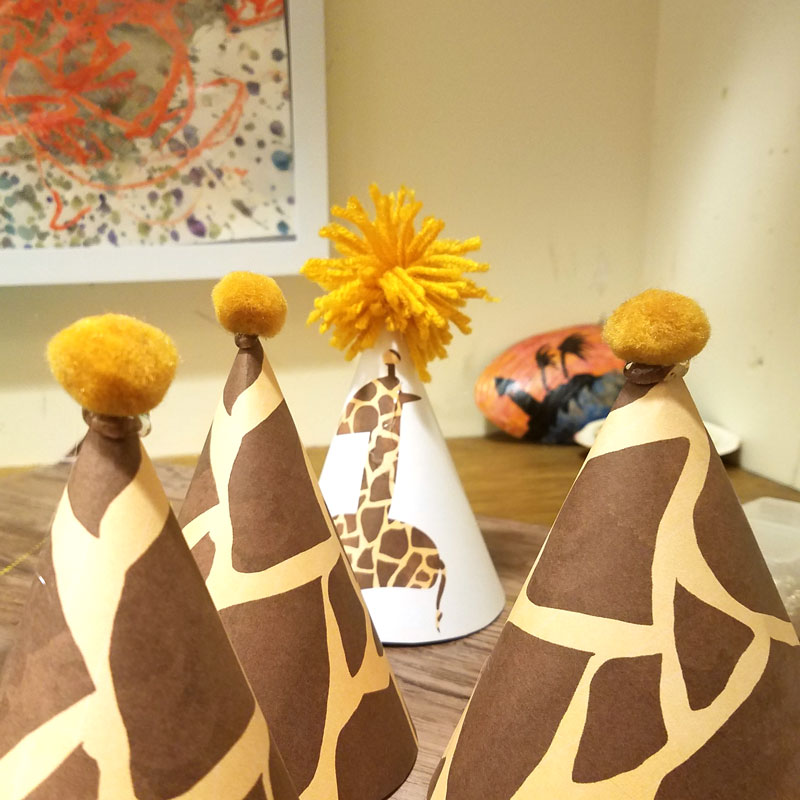 You'll love this giraffe birthday hat - including a free printable version! It's perfect for your giraffe birthday theme, or a jugle themed birthday party, or even a safari theme! It also includes a fun idea for a first birthday party theme for boys.