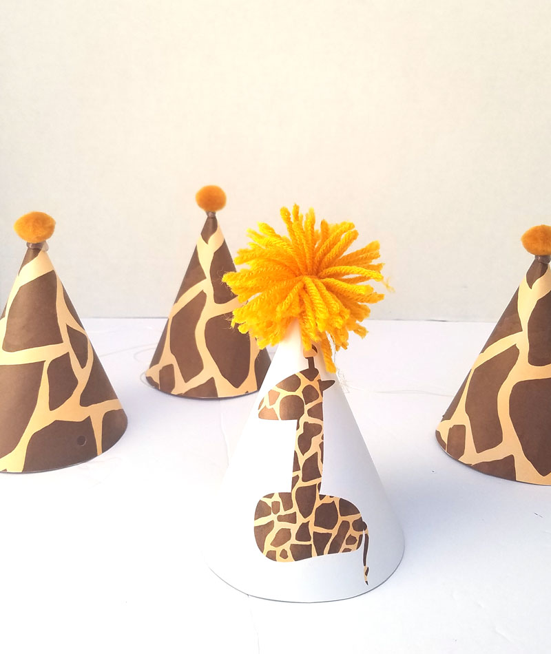 You'll love this giraffe birthday hat - including a free printable version! It's perfect for your giraffe birthday theme, or a jugle themed birthday party, or even a safari theme! It also includes a fun idea for a first birthday party theme for boys.