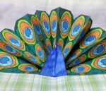 Make a pop up peacock craft! These free printable color-in peacock feathers can be used in any peacock paper craft, but you'll love the pop-up card I made with it. It's a perfect papercraft for kids or adults to create.