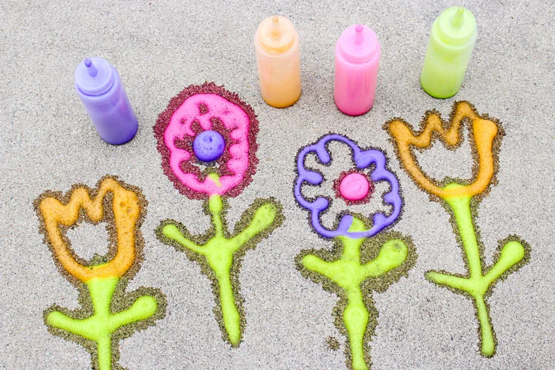 Make super easy foamy sidewalk paint - an awesome liquid sidewalk chalk recipe that's perfect for cold weather too! This outdoor art activity for kids is super easy and inexpensive, can be done in the winter, can be used to paint snow, can be carried over as a spring or summer activity too - basically, you can do anything with it!
