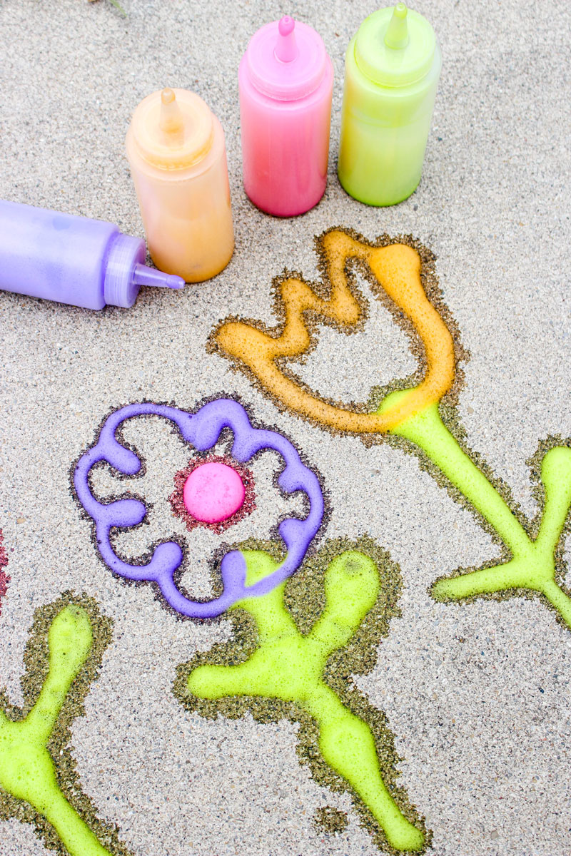 Make super easy foamy sidewalk paint - an awesome liquid sidewalk chalk recipe that's perfect for cold weather too! This outdoor art activity for kids is super easy and inexpensive, can be done in the winter, can be used to paint snow, can be carried over as a spring or summer activity too - basically, you can do anything with it!